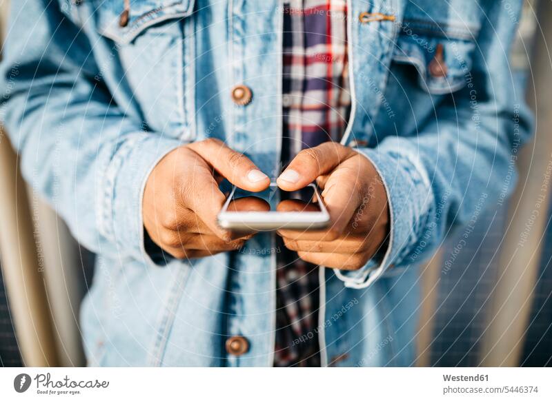 Man's hands text messaging thumb thumbs Smartphone iPhone Smartphones finger fingers human hand human hands people persons human being humans human beings