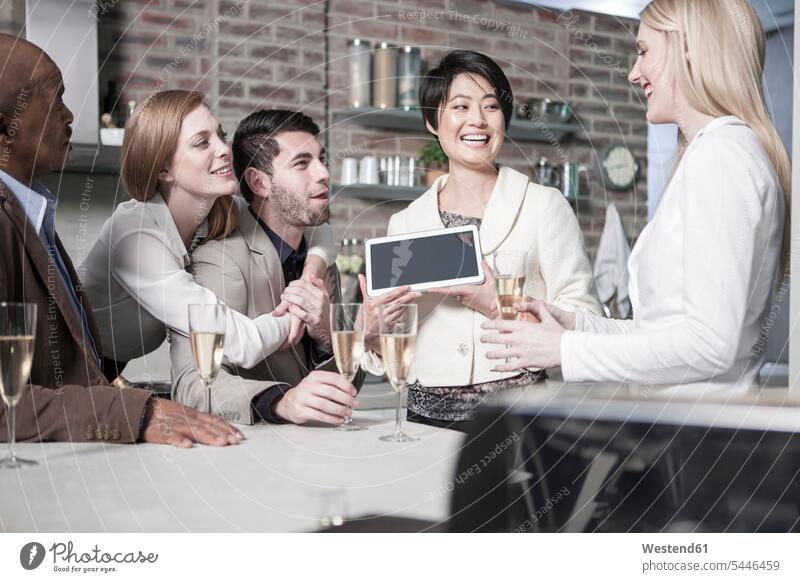 Happy woman showing tablet to friends with champagne glasses at home digitizer Tablet Computer Tablet PC Tablet Computers iPad Digital Tablet digital tablets