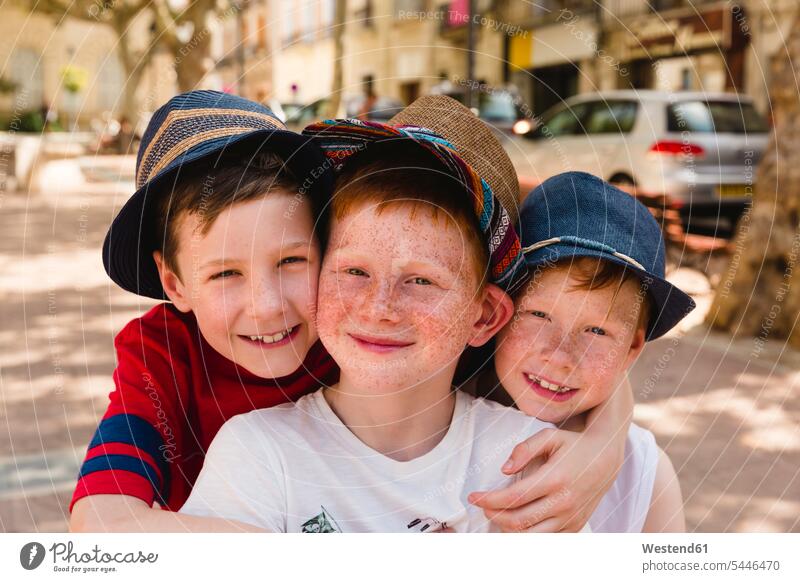 Group picture of three happy boys on holiday friends males friendship child children kid kids people persons human being humans human beings laughing Laughter