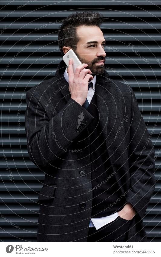Businessman on cell phone Business man Businessmen Business men mobile phone mobiles mobile phones Cellphone cell phones on the phone call telephoning