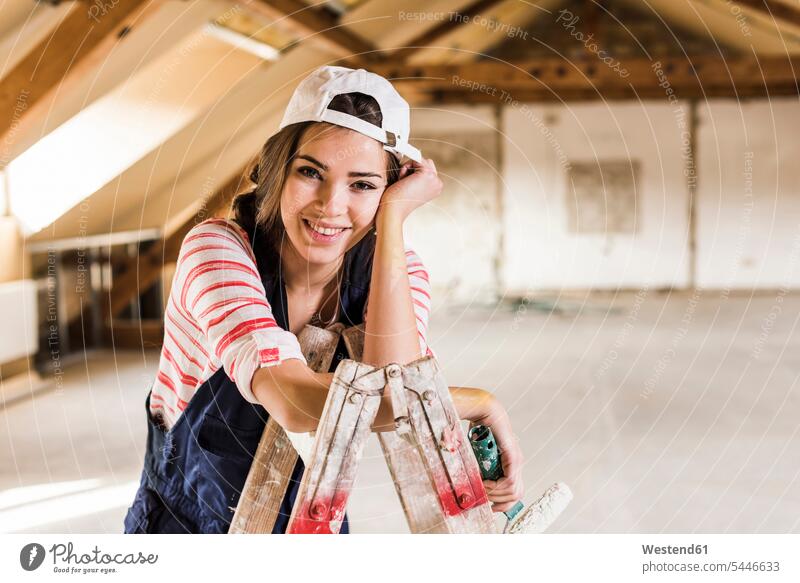 Young woman renovating her new home, holding paint roller DIY Doityourself Do it yourself Do-it-yourself young women young woman home ownership