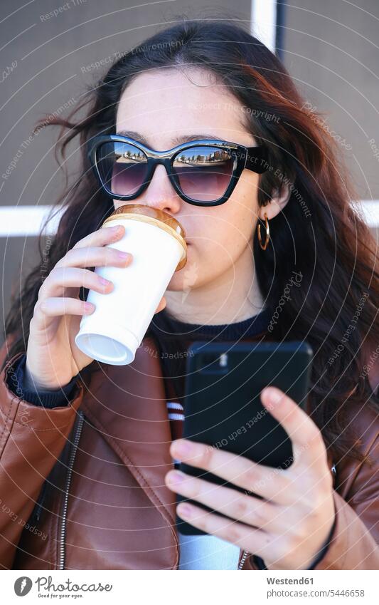 Portrait of young woman with coffee to go taking selfie with smartphone females women Selfie Selfies Adults grown-ups grownups adult people persons human being