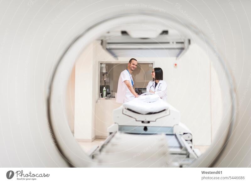 Two doctors at MRI scanner Female Doctor physicians Female Doctors smiling smile MRT magnetic resonance tomography nurse orderly male nurse portrait portraits