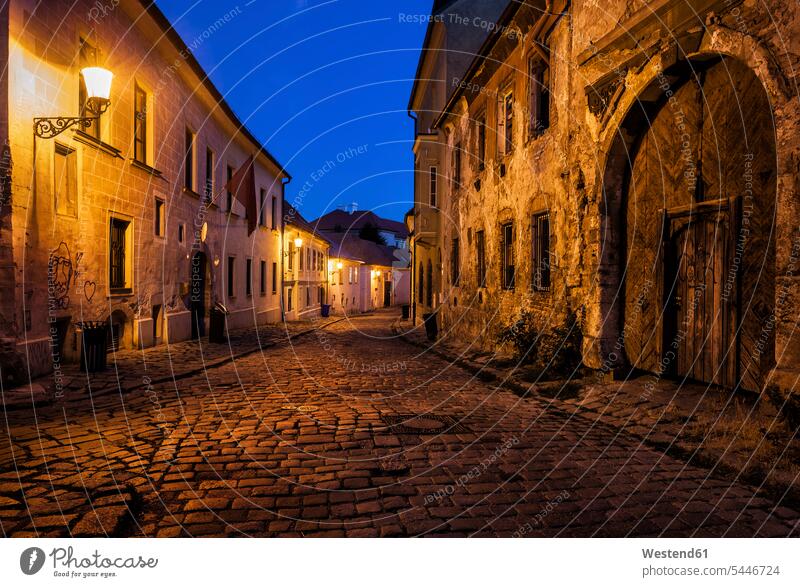 Slovakia, Bratislava, Old Town at night, cobbled street, old building with aged facade illuminated lit lighted Illuminating cobblestone pavement cobblestones