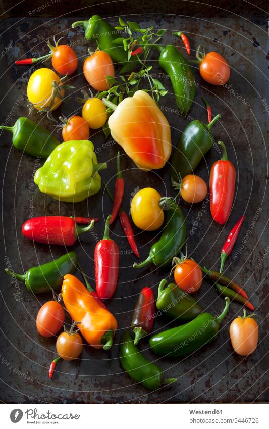 Various organic vegetables on dark ground overhead view from above top view Overhead Overhead Shot View From Above green pointed pepper orange spicy