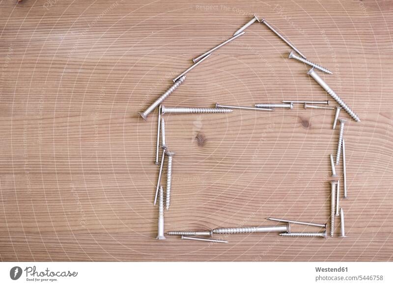 House made of screws and nails building construction model models shape shapes still life still-lifes still lifes DIY do-it-yourself real estate property