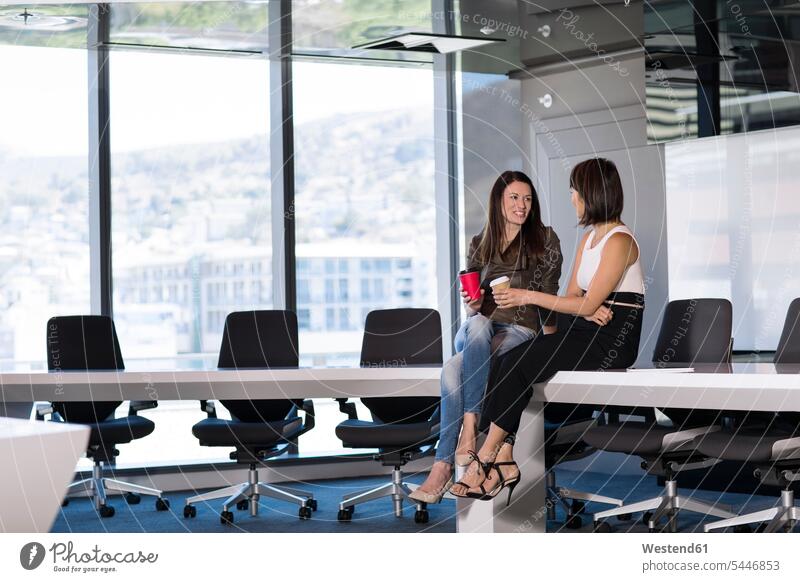 Business people sitting in conference room taking a break, talking sharing share Taking a Break resting business people businesspeople Coffee Female Colleague