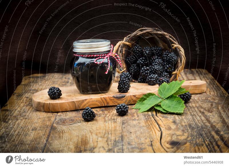 Glass of homemade blackberry jelly and blackberries on wood blackberry jam rustic Leaf Leaves food and drink Nutrition Alimentation Food and Drinks fruity Fruit