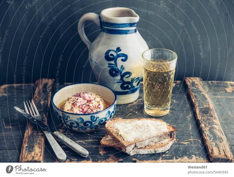 Glass and jar of Hessian cider, bread and bowl of hand cheese stoneware pickled pickles Slice of Bread Slices of Bread buttered bread hearty savoury food lusty