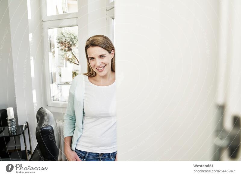 Portrait of smiling woman at home smile portrait portraits females women Adults grown-ups grownups adult people persons human being humans human beings