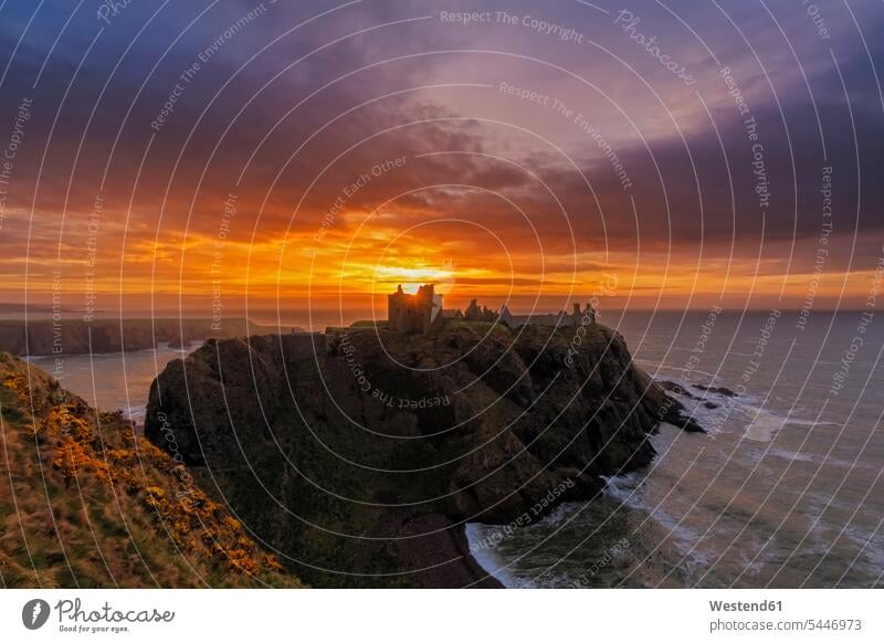 UK, Scotland, Stonehaven, Dunnottar Castle at sunrise North Sea Northsea Moody Sky Architecture outdoors outdoor shots location shot location shots Backlit