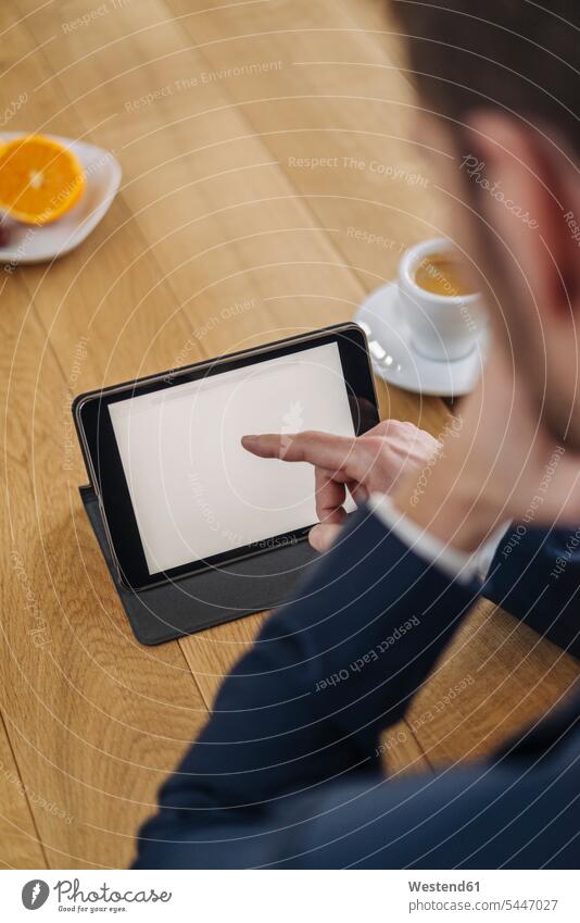 Businessman using tablet on table Business man Businessmen Business men digitizer Tablet Computer Tablet PC Tablet Computers iPad Digital Tablet digital tablets