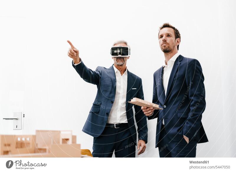 Two businessmen with VR glasses and architectural model Businessman Business man Businessmen Business men models office offices office room office rooms
