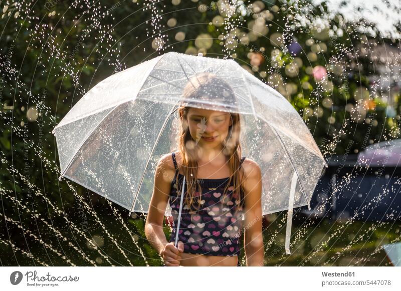 Portrait of daydreaming girl with umbrella umbrellas females girls summer summer time summery summertime Brolly child children kid kids people persons