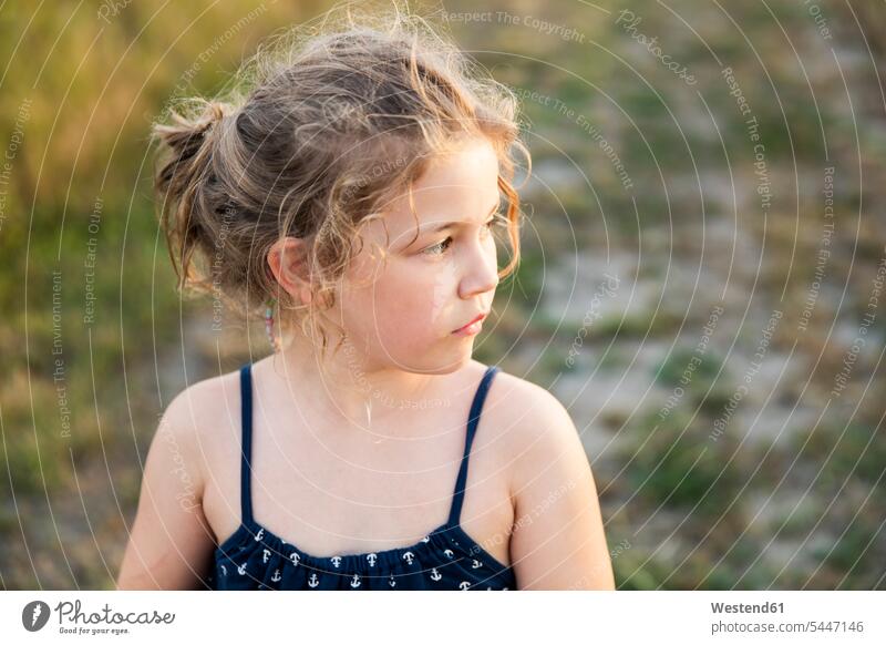 Serious girl outdoors looking sideways portrait portraits females girls child children kid kids people persons human being humans human beings summer