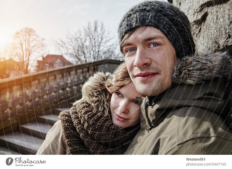 Germany, Potsdam, young couple at Glienicke Bridge portrait portraits twosomes partnership couples people persons human being humans human beings Love loving