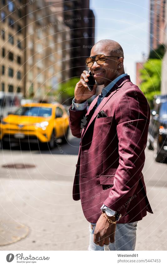 USA, New York City, Manhattan, portrait of smiling businessman on the phone call telephoning On The Telephone calling Businessman Business man Businessmen
