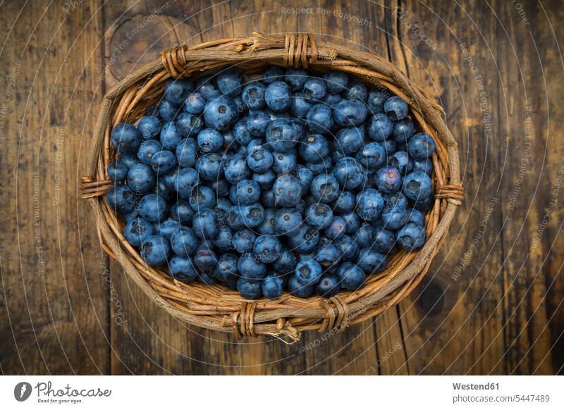 Wickerbasker of blueberries on wood copy space wooden large group of objects many objects wickerbasket wicker basket wickerbaskets wicker baskets