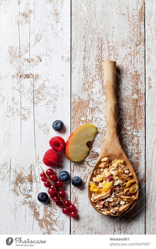 Wooden spoon of granola with dried fruits and various fresh fruits on wood nobody Oat Flakes rolled oats Raspberry Raspberries Shabby chic Fruit Fruits