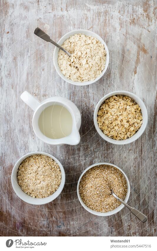 Variation of oat flakes and milk in a small can food and drink Nutrition Alimentation Food and Drinks Spoon Spoons Oat Avena sativa Oats Oat Flakes rolled oats