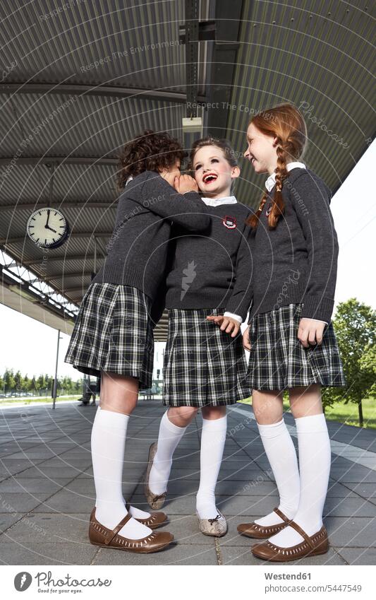 Three girls at platform wearing school uniform female friends females schoolgirl female pupils School Girl schoolgirls School Girls mate friendship child