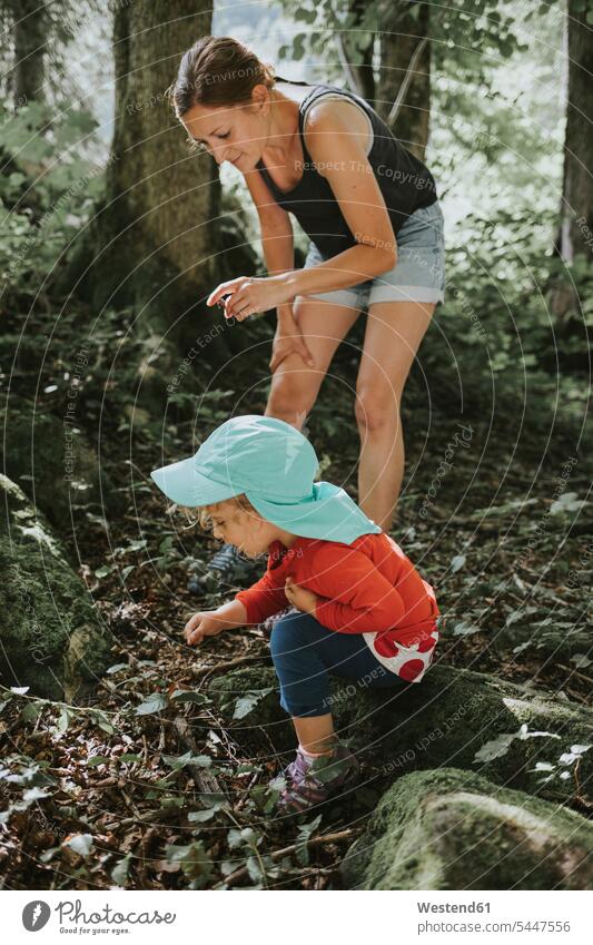 Mother and toddler on a trip in forest daughter daughters mother mommy mothers ma mummy mama woods forests child children family families people persons