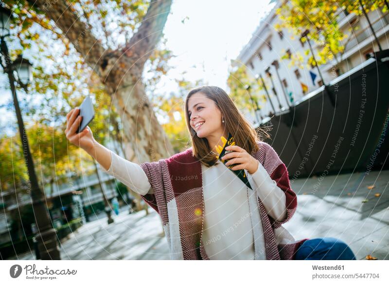 Young woman in Sevilla taking selfie and eating french fries caucasian caucasian ethnicity caucasian appearance european waist up Waist-Up upper body