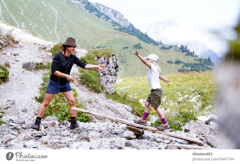 Austria, South Tyrol, girl balancing on wood nature natural world female hiker female wanderers goal goals walking going Adventure adventurous Adventures wooden