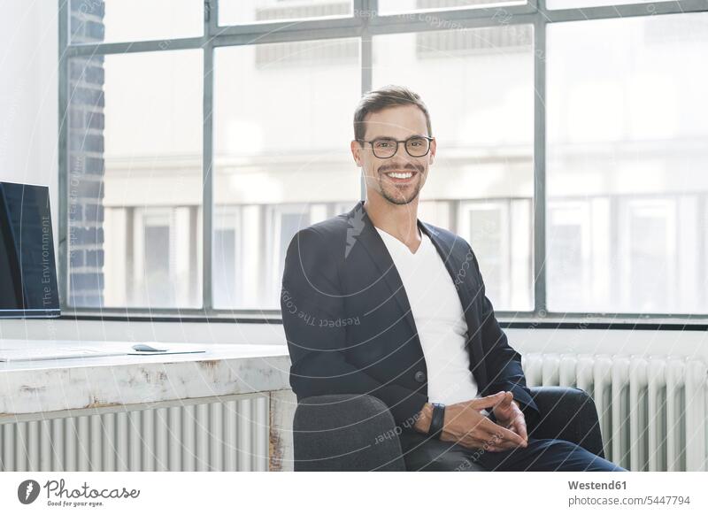 Portrait of a young businessman in his office portrait portraits friendly nice Success successful smiling smile Businessman Business man Businessmen