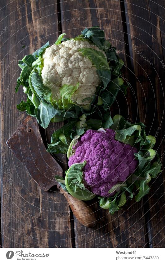 White and purple cauliflower and old cleaver on dark wood food and drink Nutrition Alimentation Food and Drinks chopping knife chopper cleavers choppers