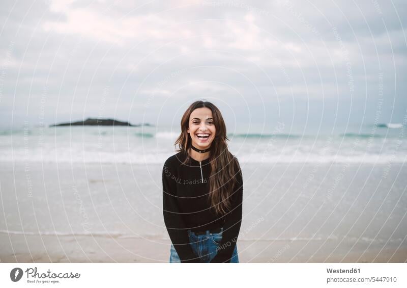 Portrait of laughing young woman on the beach portrait portraits Laughter females women positive Emotion Feeling Feelings Sentiments Emotions emotional Adults