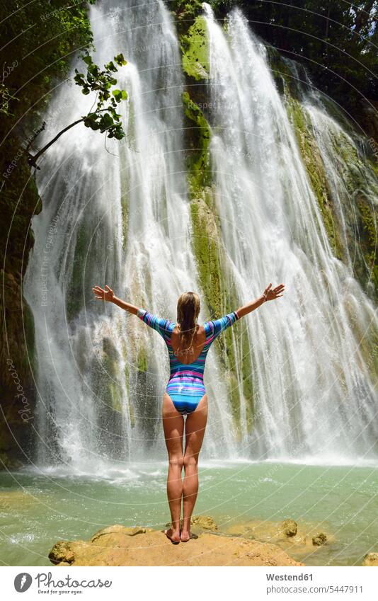 Dominican Republic, Samana, woman admiring huge waterfall waterfalls females women happiness happy standing waters body of water Adults grown-ups grownups adult