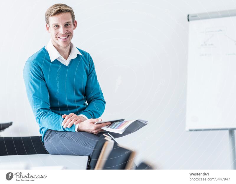 Portrait of smiling businessman in office portrait portraits smile Businessman Business man Businessmen Business men offices office room office rooms