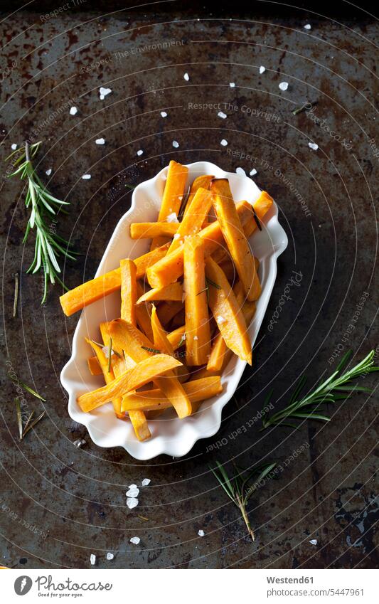 Sweet potato fries with rosmary and salt in porcelain bowl food and drink Nutrition Alimentation Food and Drinks coarse scattered vegetarian Vegetarian Food