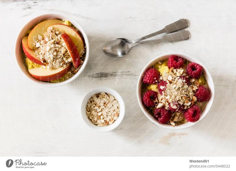 Bowl of porridge with raspberries and bowl of porridge with apples food and drink Nutrition Alimentation Food and Drinks divers Raspberry Raspberries Oat Flakes