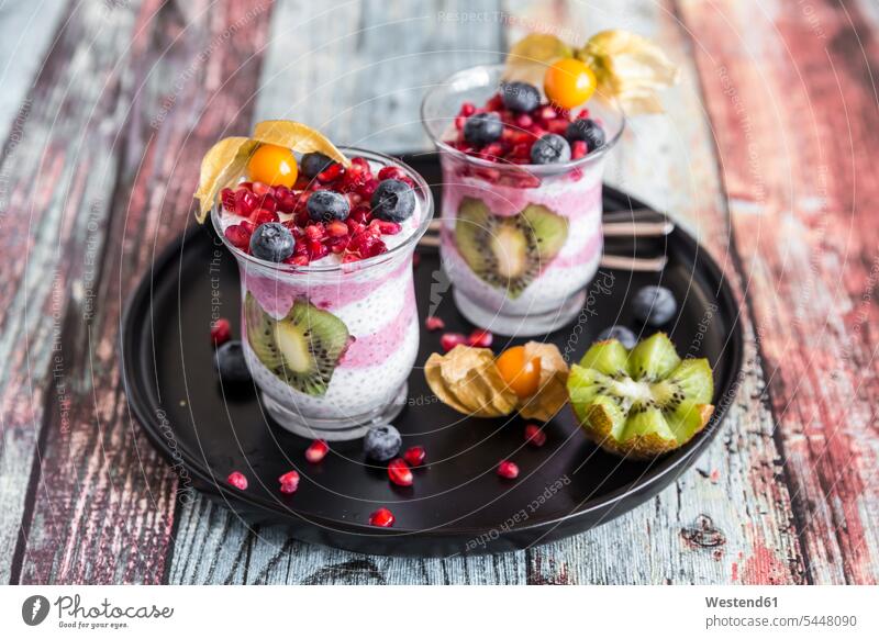Two glasses of chia pudding with several fruits food and drink Nutrition Alimentation Food and Drinks Chia Pudding healthy eating nutrition Salvia hispanica