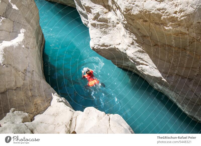 Woman bathing in a clear river flowing between two rocks Wadi Nature Sand Dry Vacation & Travel clear water River Water Tourism Swimming & Bathing popular Oman