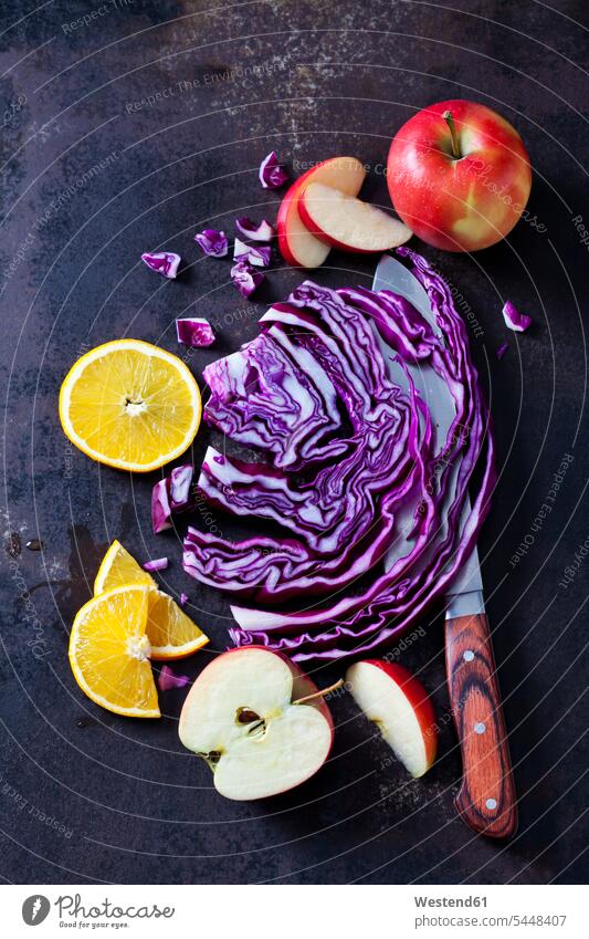 Sliced red cabbage, apples and orange slices on dark ground nobody Fruit Fruits red apple red apples Apple Apples Red Cabbage Purple Cabbage copy space purple