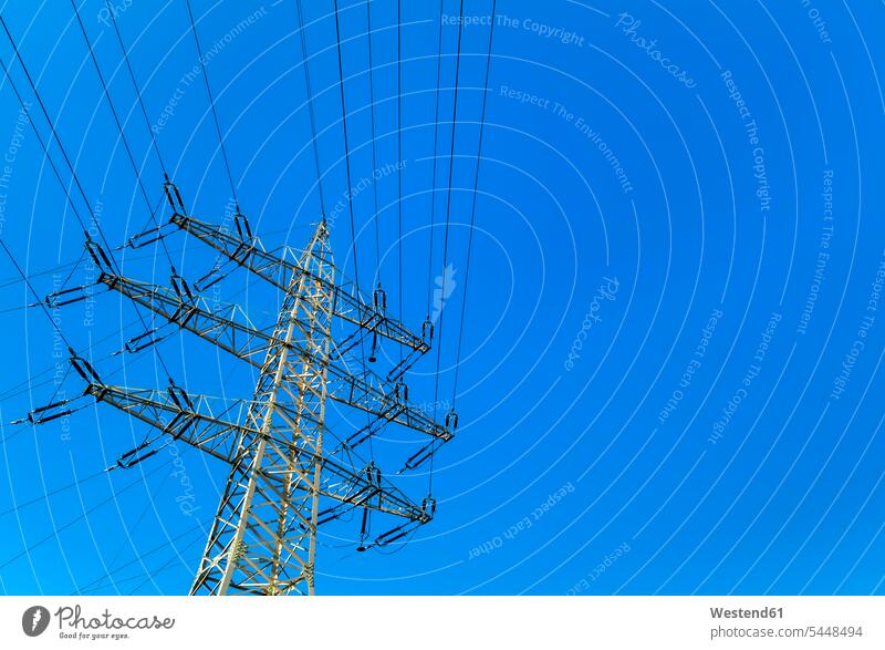 Power pylon under blue sky low section Waist Down energy industry power industry Electricity Pylon outdoors outdoor shots location shot location shots sunlight