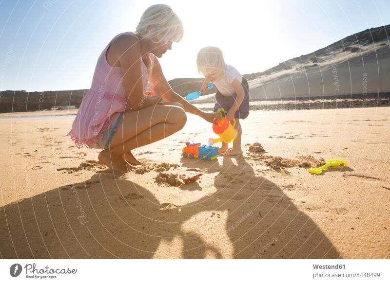 Spain, Fuerteventura, mother and daughter playing on the beach beaches happiness happy vacation Holidays Travel one parent El Salmo quality of life Quality Time