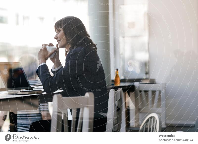 Businesswoamn with laptop, sitting in cafe, drinking coffee caucasian caucasian ethnicity caucasian appearance european Coffee Wifi Wi-Fi wireless internet WLan