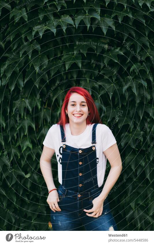 Portrait of redhead woman wearing dungarees Bib Overall Bibs Overall Bib Overalls females women Adults grown-ups grownups adult people persons human being