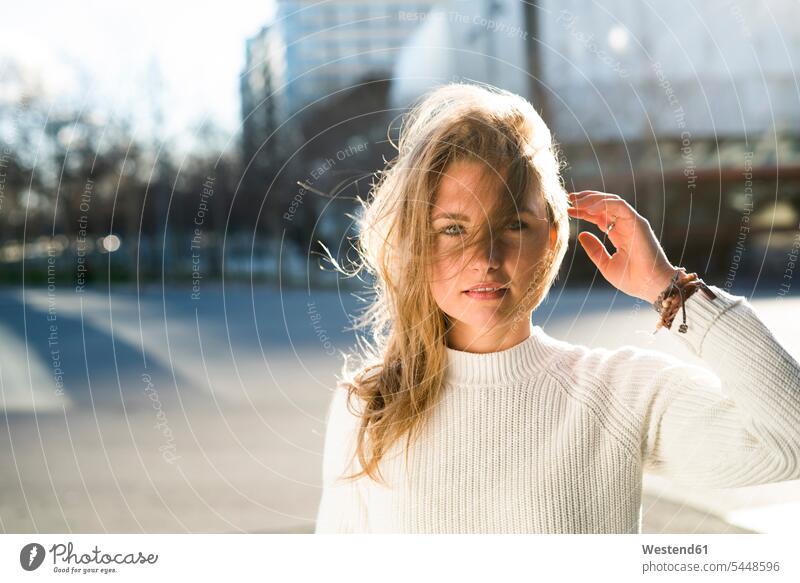 Portrait of smiling woman with blowing hair females women portrait portraits Adults grown-ups grownups adult people persons human being humans human beings