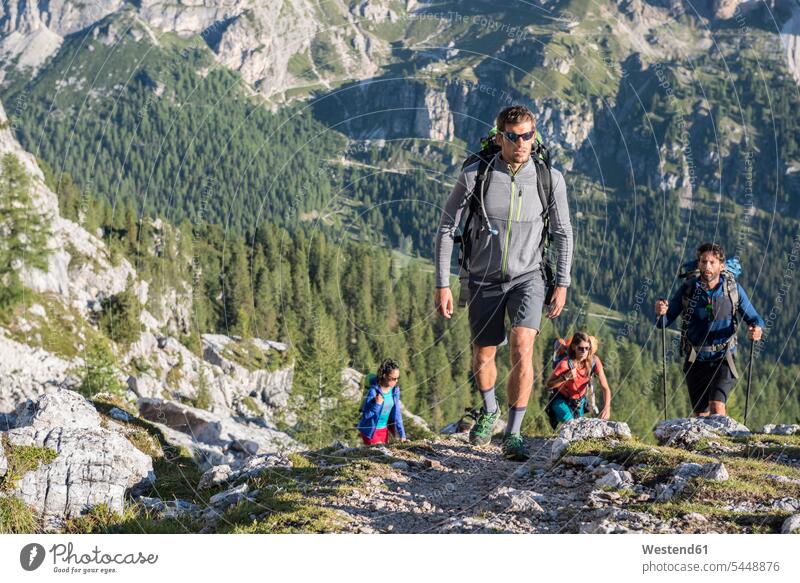 Italy, Friends trekking in the Dolomtes climber alpinists climbers mountaineer Mountain Climber mountaineers Mountain Climbers ascent hiking mountain hike