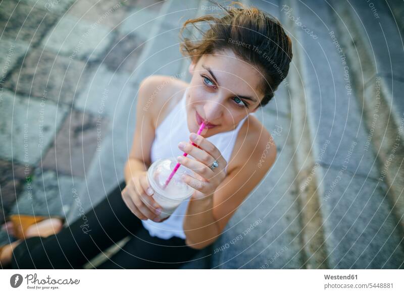 Portrait of young woman drinking a smoothie females women Smoothies Adults grown-ups grownups adult people persons human being humans human beings Drink