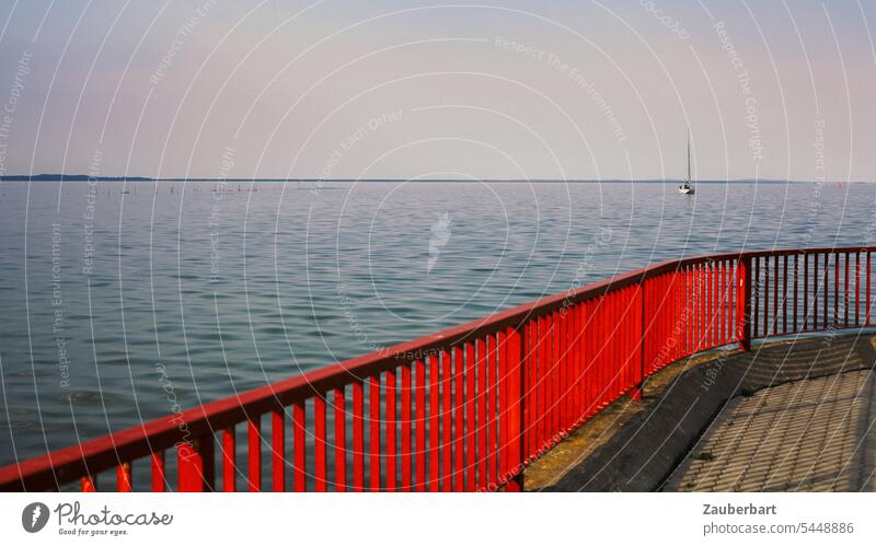 Red railing, sea, horizon and a sailboat in the distance Ocean Horizon Sailboat Sailing wide Far-off places Wanderlust voyage Water coast Vacation & Travel