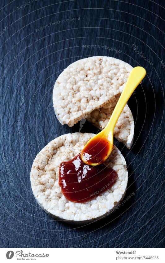 Rice cakes with jam on slate food and drink Nutrition Alimentation Food and Drinks baked Baked Food broken off circle circles circular half halves halved Jam