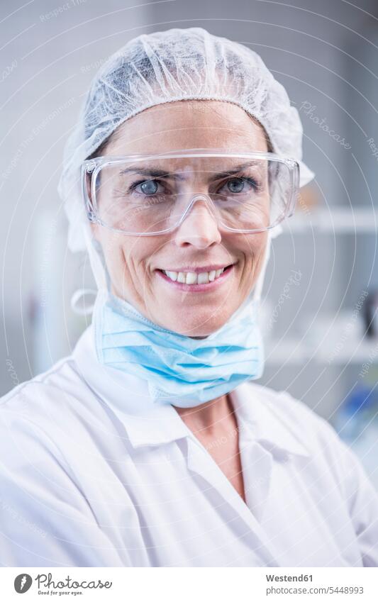 Portrait of smiling scientist in lab portrait portraits confidence confident laboratory female scientists science sciences scientific woman females women