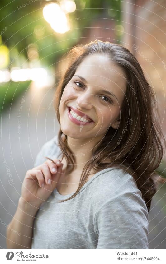 Portrait of smiling young woman outdoors portrait portraits females women smile Adults grown-ups grownups adult people persons human being humans human beings