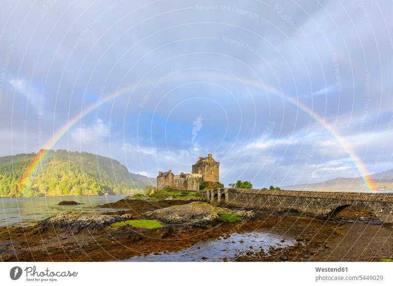 UK, Scotland, Dornie, Loch Duich, Eilean Donan Castle with rainbow cloud clouds View Vista Look-Out outlook cloudy cloudiness nature natural world Lakeshore